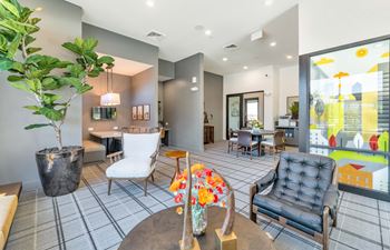 a living room with chairs and a table and a window at Weylyn Luxury Apartments, Arizona